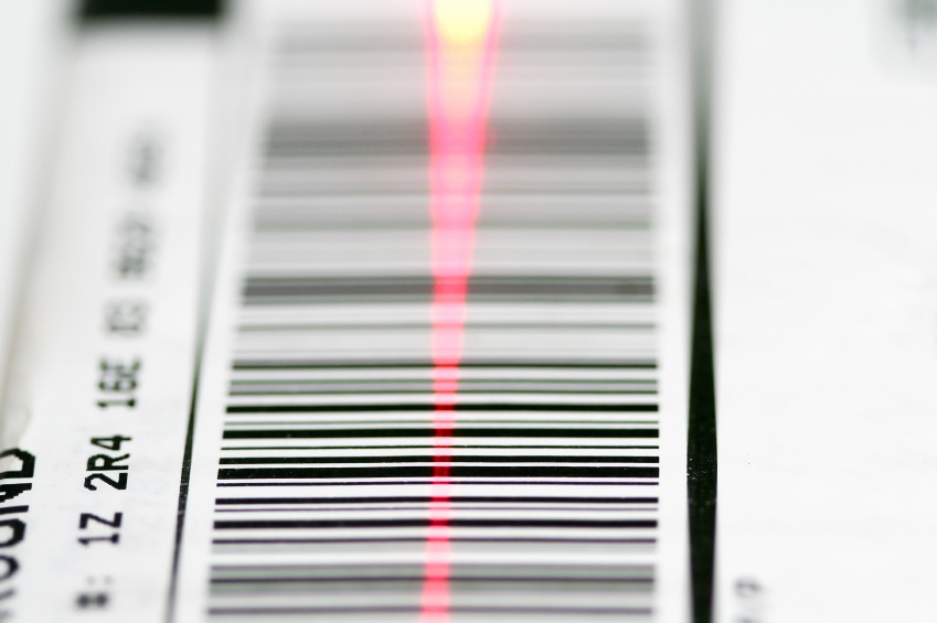 Package tracking barcode being read by a scanner.